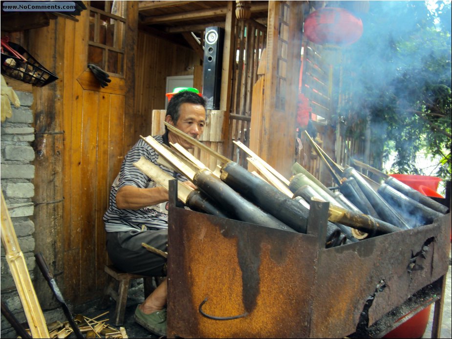 cooking rice in bamboo.JPG