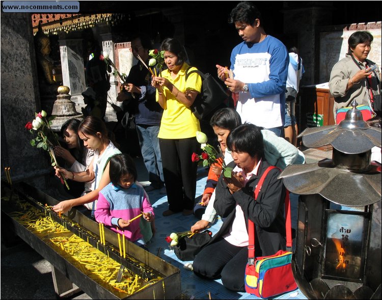 Wat Phrathat Doi Suthep - Buddha offerings.jpg