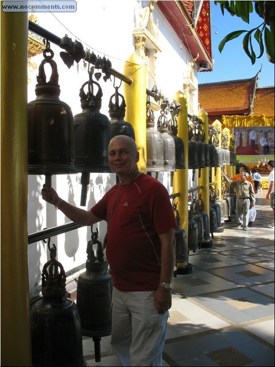 Wat Phrathat Doi Suthep - hitting bells for good luck.jpg