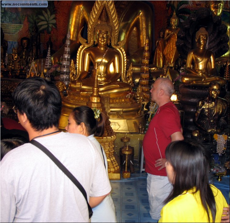 Wat Phrathat Doi Suthep - kneeling before Buddha.jpg