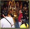 Wat Phrathat Doi Suthep - kneeling before Buddha.jpg